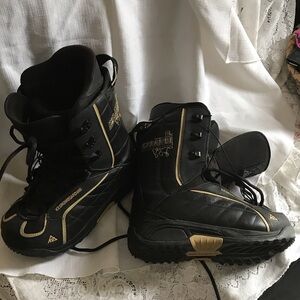 Stylish Black Snowboard Boots with Gold Accents